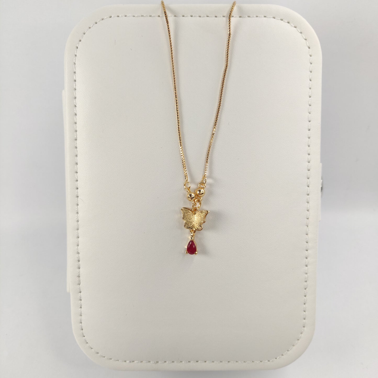 Golden Butterfly Necklace with Teardrop Red Gemstone