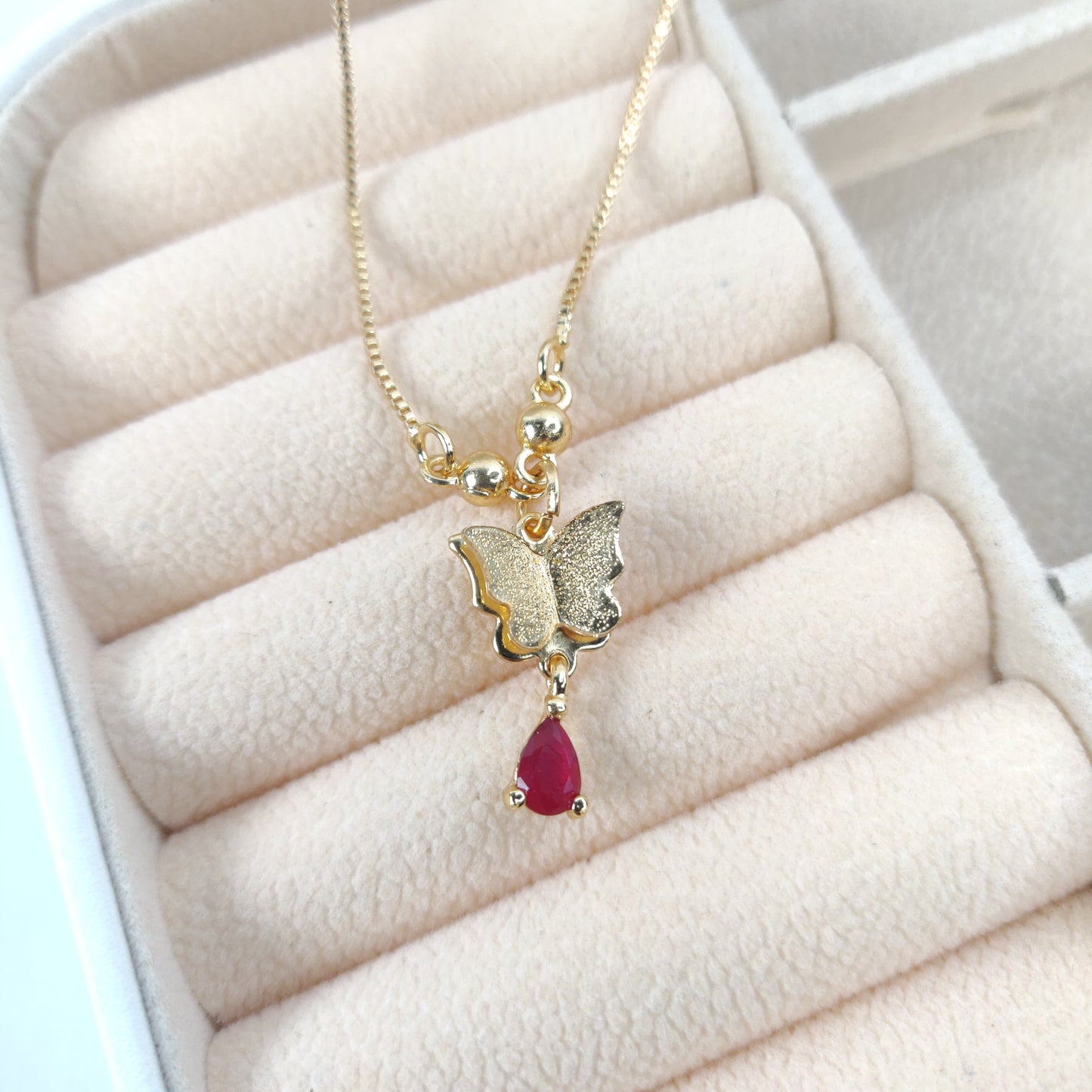 Golden Butterfly Necklace with Teardrop Red Gemstone