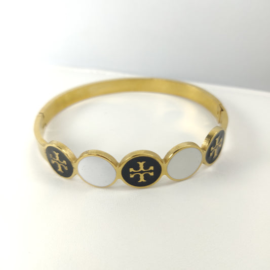 Gold-Plated Bangle with Black and White Round Enamel Accents