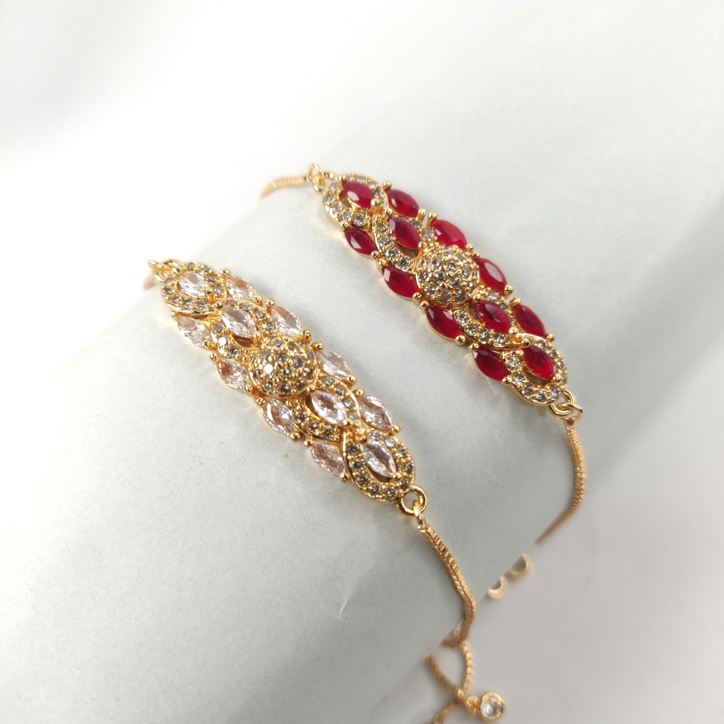 Gold Bracelet with Red and White Gem-Encrusted Pendant