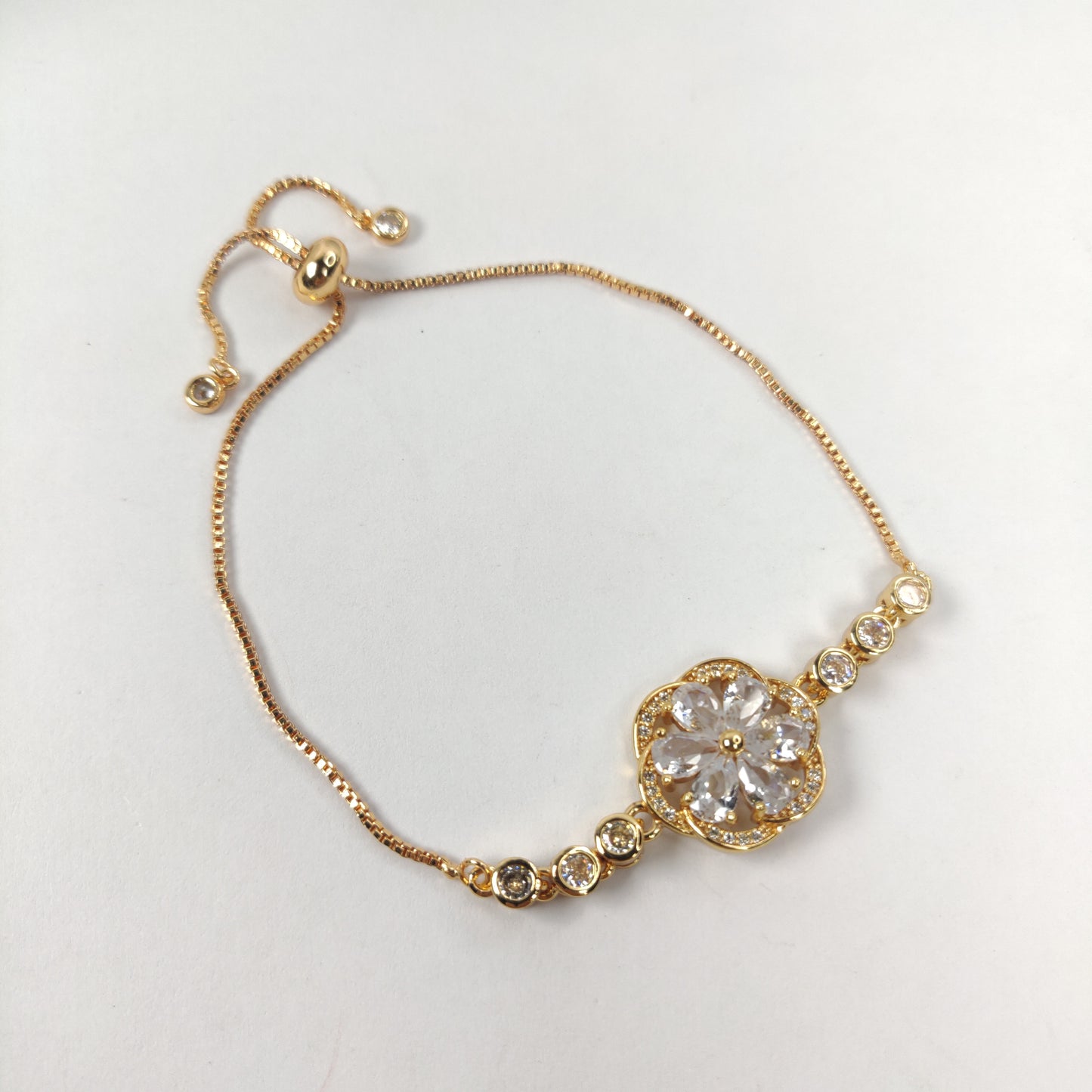 Gold Bracelet with Gemstone Flower Pendant