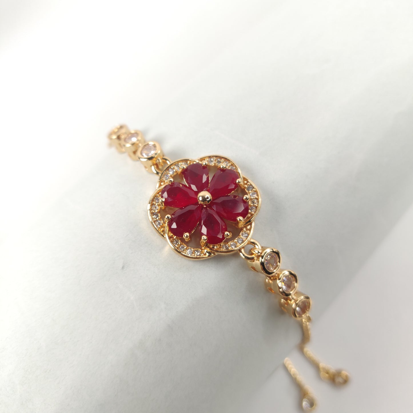 Gold Bracelet with Gemstone Flower Pendant