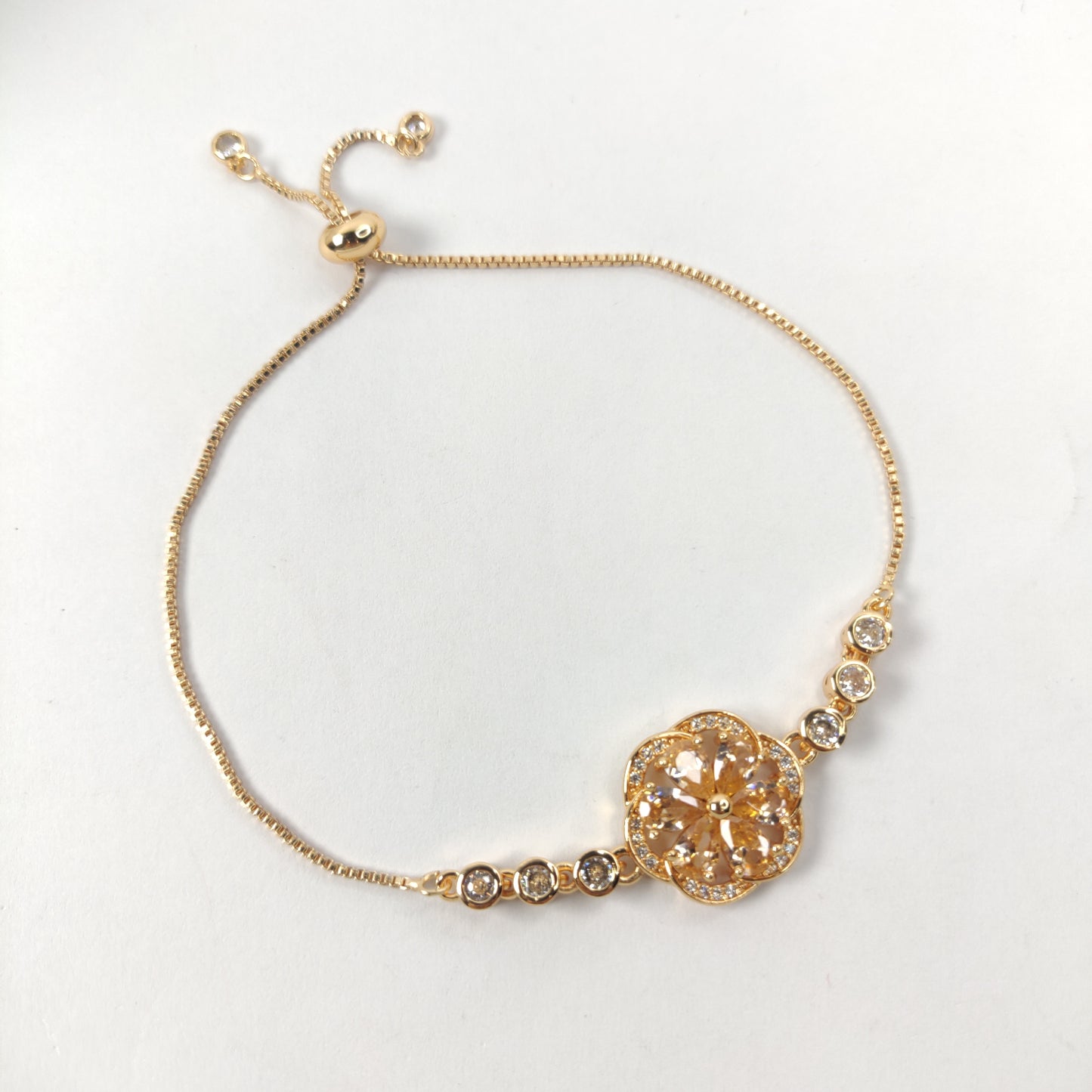 Gold Bracelet with Gemstone Flower Pendant